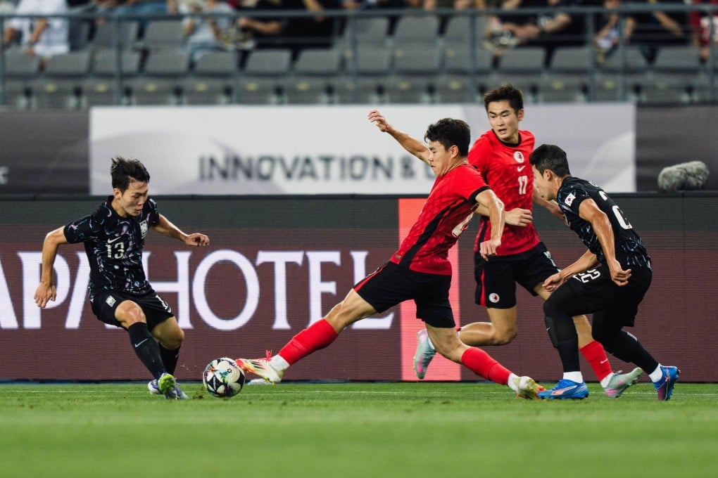 Sun Ming-him puts his foot in to challenge scorer Kang Sang-yoon. Photo: HKFA