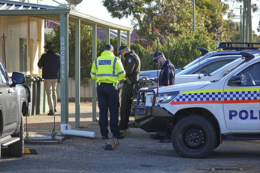 Police officers gather in Beacon, Western Australia on Friday as they prepare to search for missing German backpacker Carolina Wilga. Photo: via AP