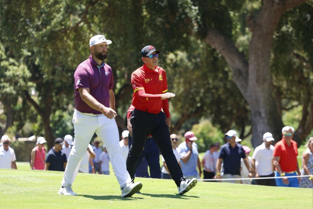 Jon Rahm (left) and Sergio Garcia walk down the fairway during the first day of the LIV Golf Andalusia. Photo: EPA