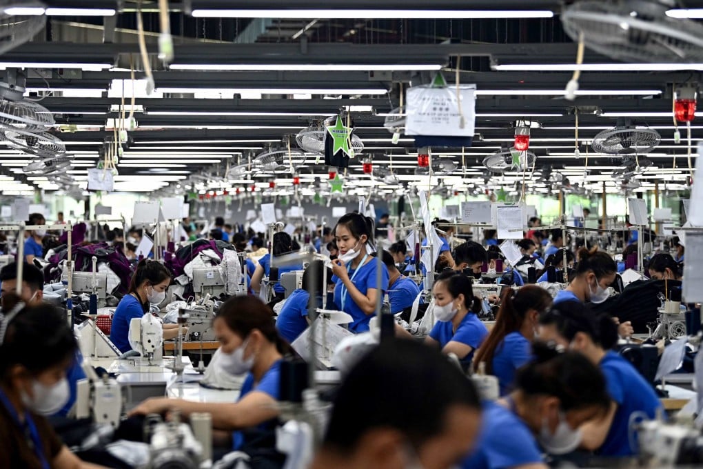 Workers stitch garments at a factory in Vietnam’s Thai Nguyen province on July 2. Photo: AFP