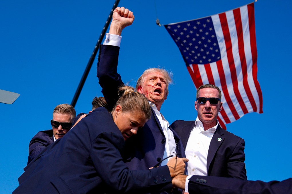 Donald Trump is surrounded by US Secret Service agents after an assassination attempt at a campaign rally in Butler, Pennsylvania, in July 2024. Photo: AP