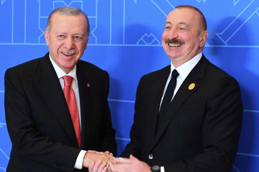 Azerbaijani President Ilham Aliyev (right) with Turkish President Recep Tayyip Erdogan during their meeting on the sidelines of the 17th Summit of the Economic Cooperation Organization in Azerbaijan on July 4. Photo: Azerbaijani Presidential Press Office/AP