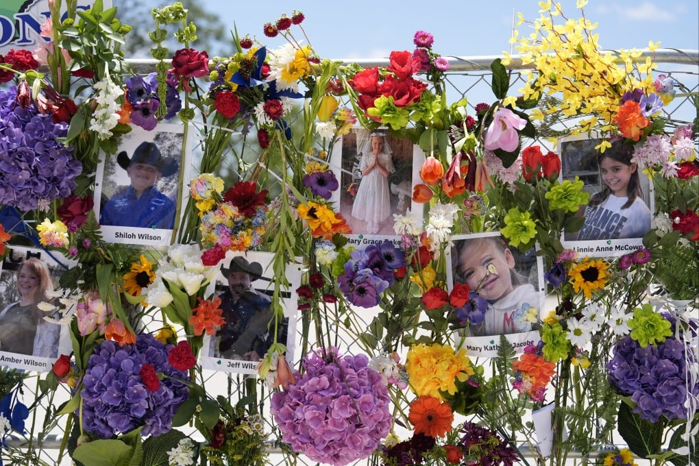 Photographs of flood victims displayed on a memorial wall in Kerrville, Texas. Photo: AP