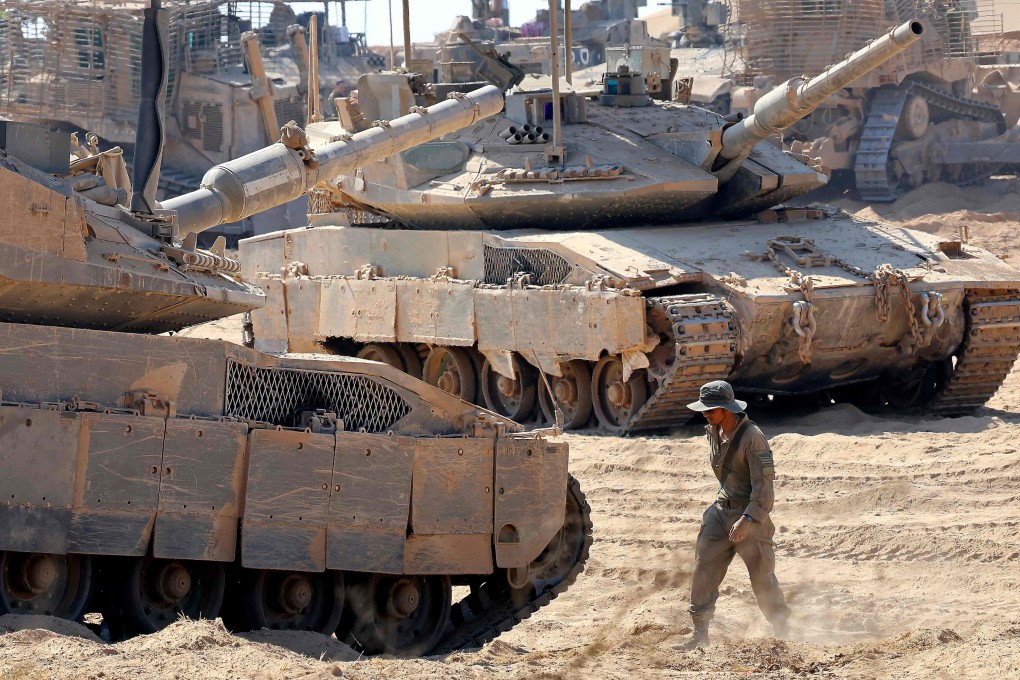 Israeli troops deployed by Israel’s border fence with the Gaza Strip on July 10 amid the ongoing war with the Palestinian militant movement Hamas. Photo: AFP