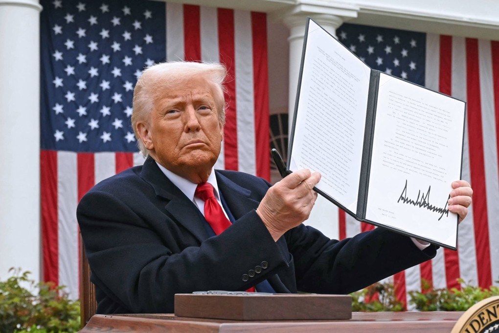 US President Donald Trump holds a signed executive order on “reciprocal” tariffs on April 2. Photo: AFP