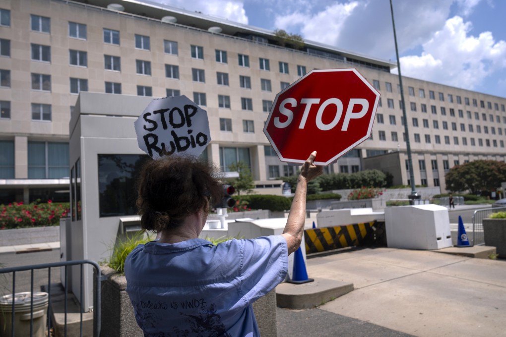 A former Foreign Service employee demonstrates against potential lay-offs at the US State Department on Friday. Photo: AP