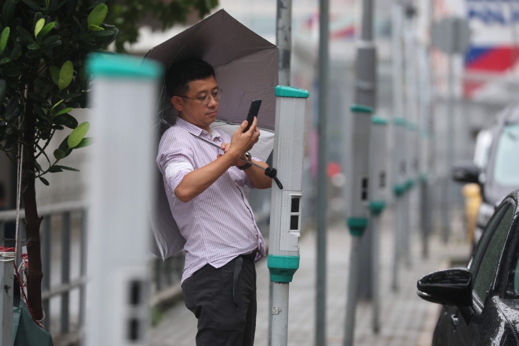 A resident uses a parking meter in Sai Wan Ho. Photo: Edmond So