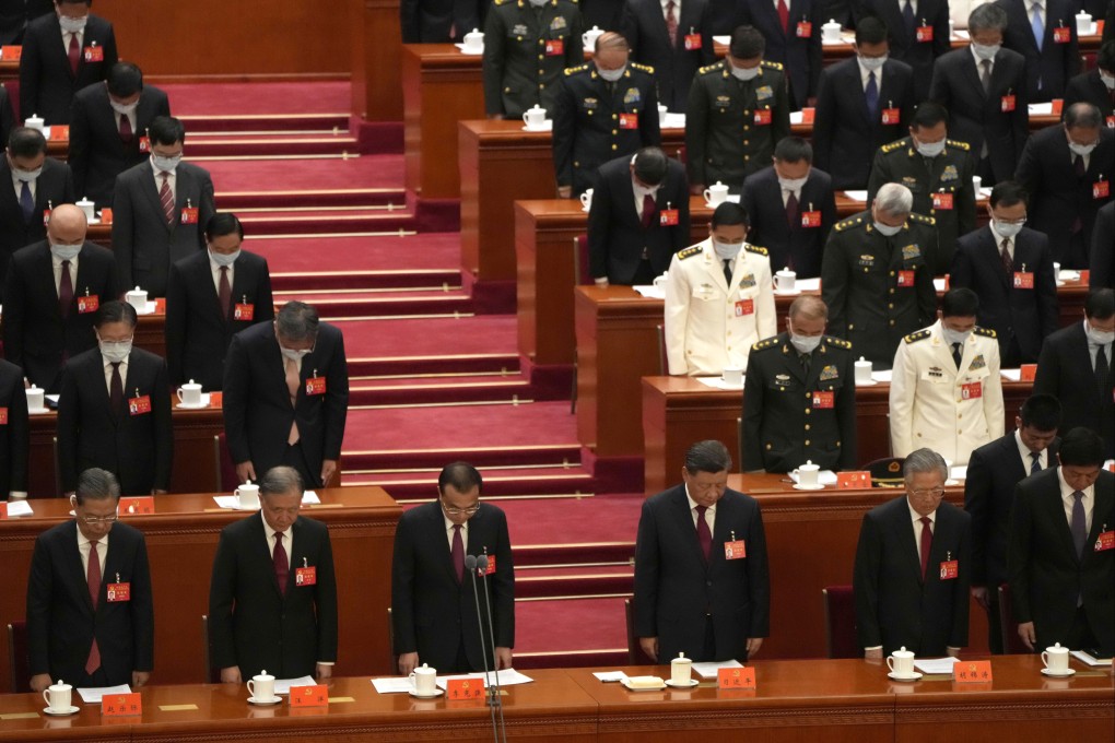 Attendees bow their heads to observe a moment of silence for ‘fallen comrades’ during the opening ceremony of the 20th National Congress of China’s ruling Communist Party, in Beijing, October 16, 2022. Photo: AP