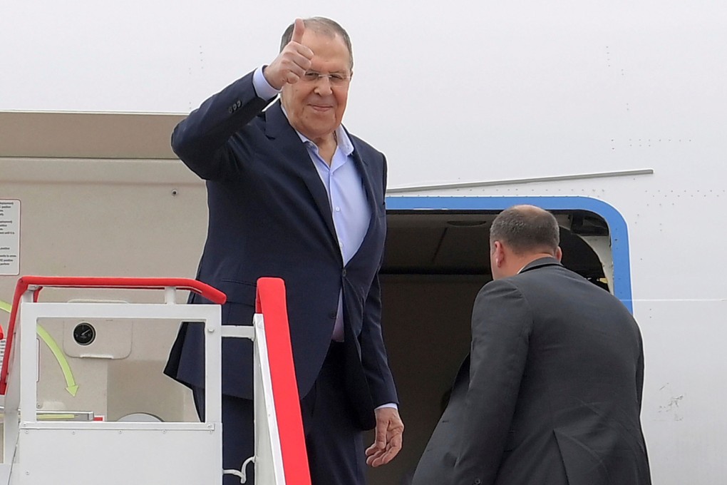 Russian Foreign Minister Sergey Lavrov gives a thumbs up as he prepares to depart from North Korea’s Wonsan Kalma Airport on Sunday. Photo: KCNA/KNS/AP