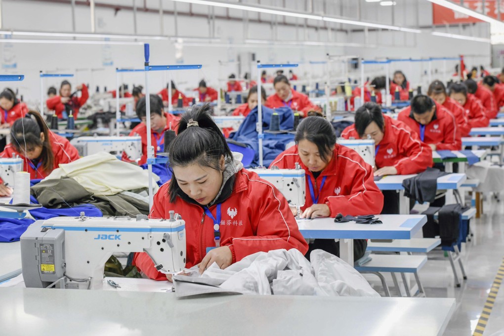 Workers sew apparel at a garment workshop in Zunhua, north China’s Hebei Province. Photo: Xinhua
