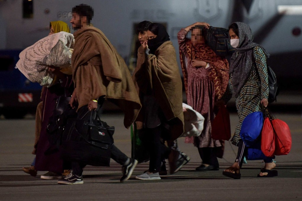 Afghan refugees, fleeing the capital of Kabul, arrive at Pristina International airport in Kosovo in August 2021. Photo: AFP