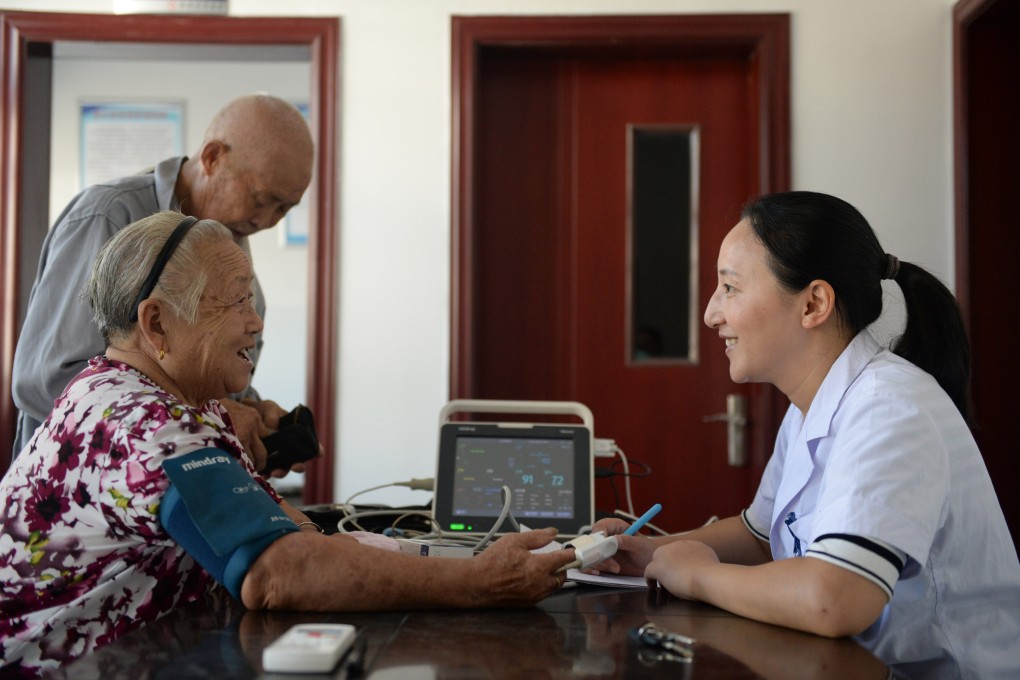 Medical staff measures blood pressure for a villager at Huanju village in Qiyunshan township of Xiuning county, east China’s Anhui province, on August 6, 2019. Photo: Xinhua