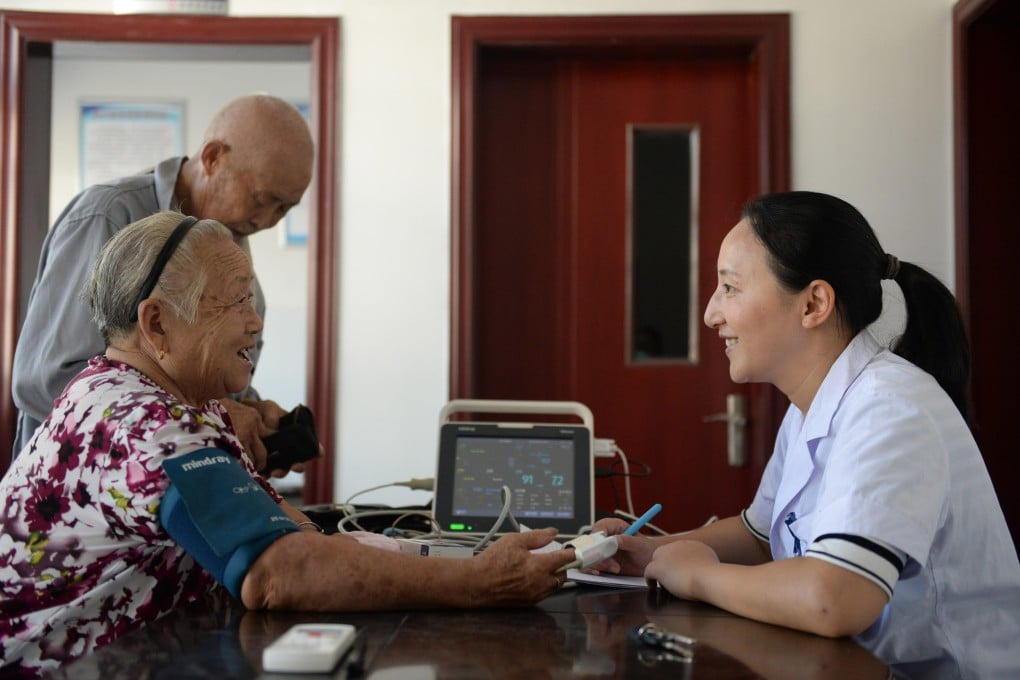 Medical staff measures blood pressure for a villager at Huanju village in Qiyunshan township of Xiuning county, east China’s Anhui province, on August 6, 2019. Photo: Xinhua