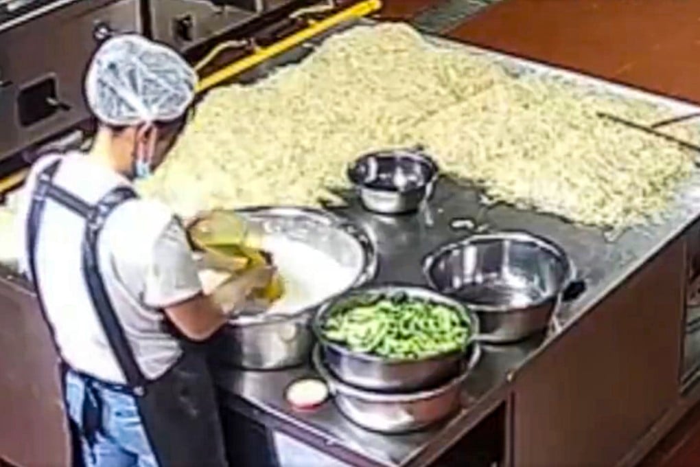 A screenshot of footage of kitchen staff at a Gansu kindergarten where children have fallen ill with lead poisoning. Photo: handout