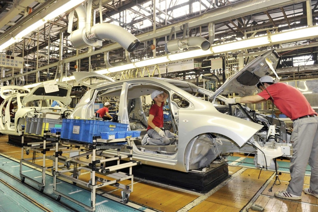 Nissan Motor employees assemble the company’s electric vehicle Leaf at the Oppama plant in suburban Tokyo. The plant will halt at the end of its 2027 fiscal year. Photo: AFP