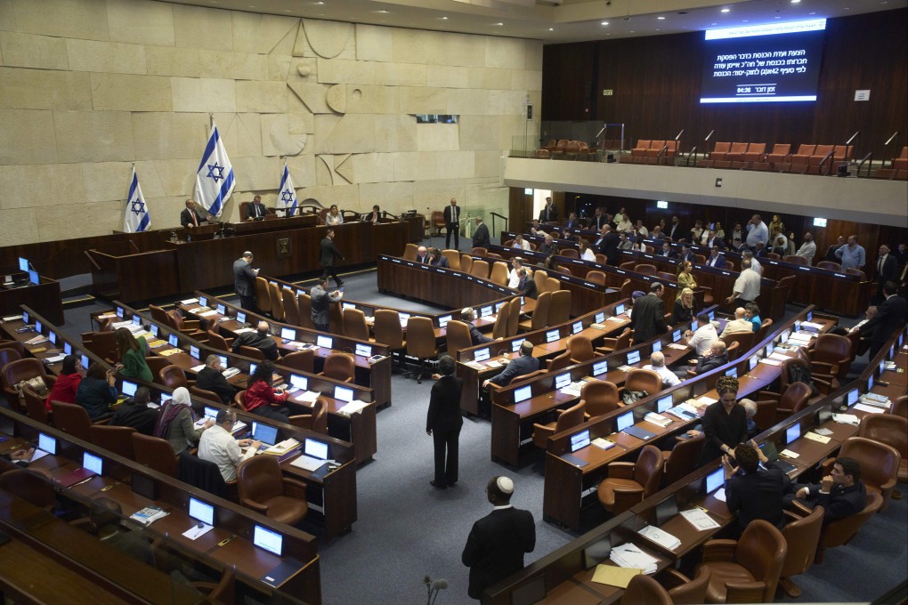Lawmakers attend a session of the Knesset, Israel’s parliament, in Jerusalem on Monday. Photo: AP