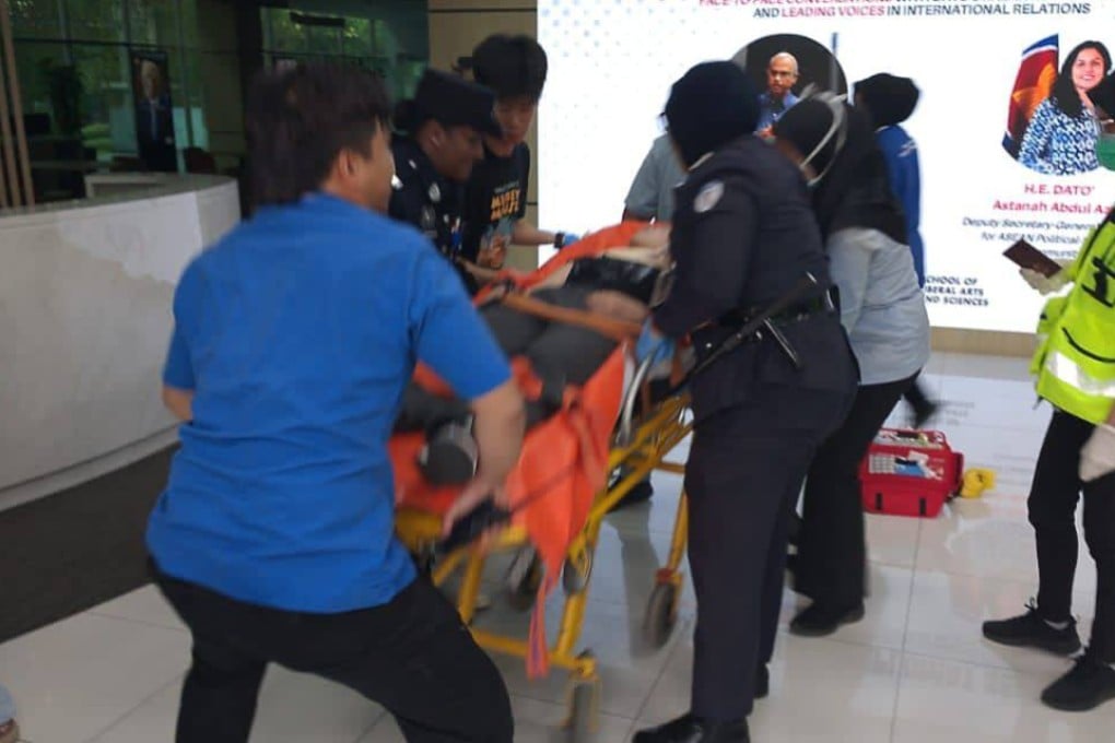 A photo released by Malaysian police shows the 20-year-old Chinese victim of a knife attack at Taylor’s University, Malaysia, being rushed to hospital for treatment on Monday. Photo: Handout