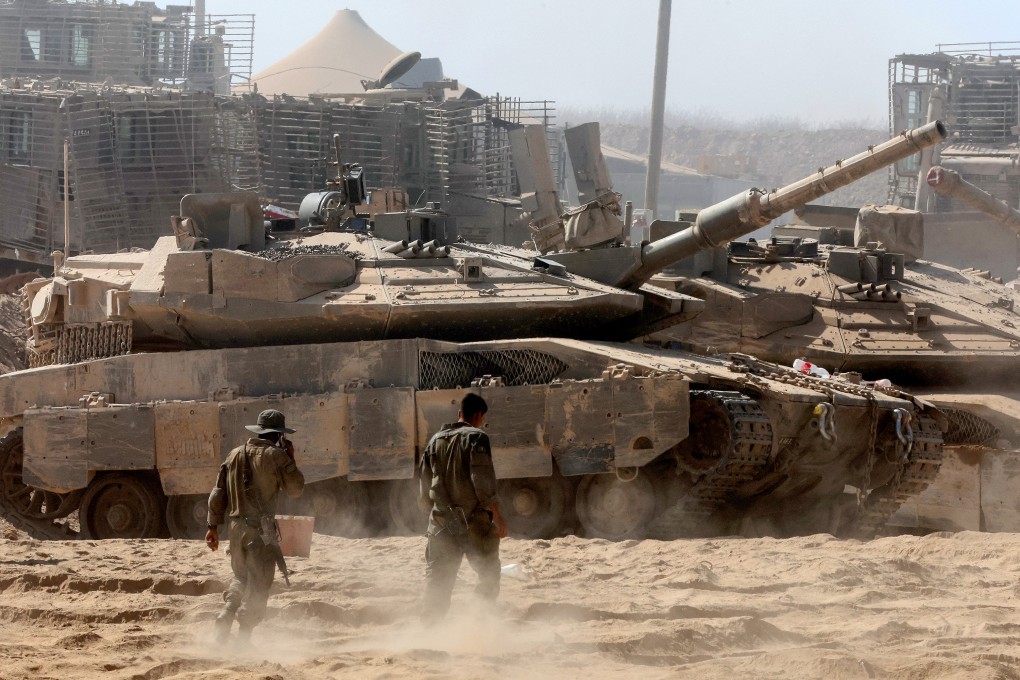 Israeli troops deploy by Israel’s border fence with Gaza. Photo: AFP / Getty Images / TNS