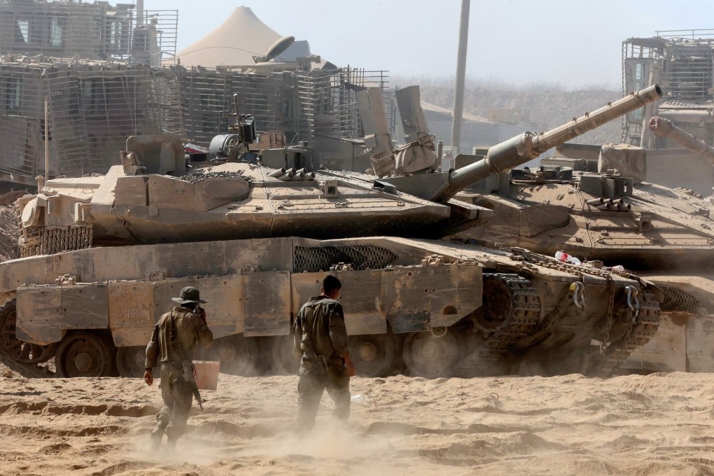 Israeli troops deploy by Israel’s border fence with Gaza. Photo: AFP / Getty Images / TNS