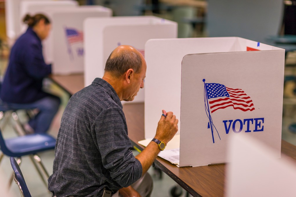 A voter at polls during presidential election, using paper ballots. Photo: Shutterstock