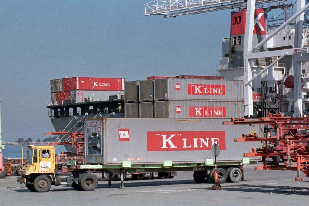 A truck carrying a cargo container belonging to the Japanese-owned K Line shipping company passes is loaded in the Oakland Harbour. Photo: Reuters