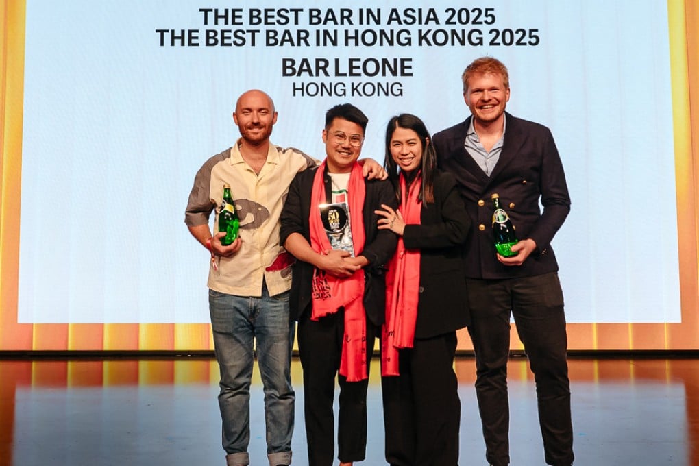 (From left) Bar Leone’s Lorenzo Antinori, Justin Wah and Wing Lo celebrate on stage with Perrier representative PJ Gheysen as the bar grabs top spot on the Asia’s 50 Best Bars list, for the second year running, on July 15, 2025. Photo: Asia’s 50 Best Bars