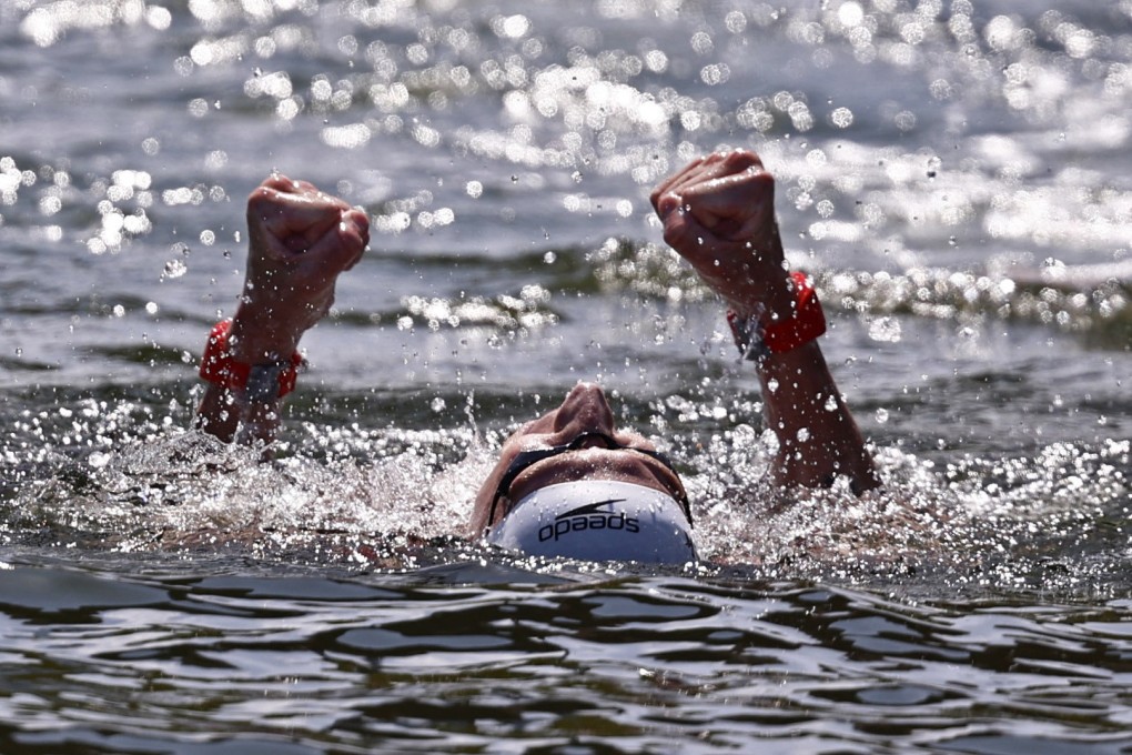 Germany’s Florian Wellbrock reacts after finishing first to win the gold medal in the 10km open water race. Photo: Reuters