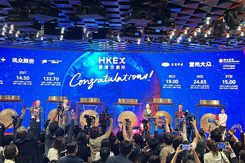 Hong Kong’s stock exchange marked its busiest day of the year on July 9, when five companies made their debuts: semiconductor chip designer Fortior Technology, Lens Technology, Wuhan Dazhong Dental Medical, robotic logistics firm Beijing Geekplus and Beijing Xunzhong Communication. Photo: Aileen Chuang