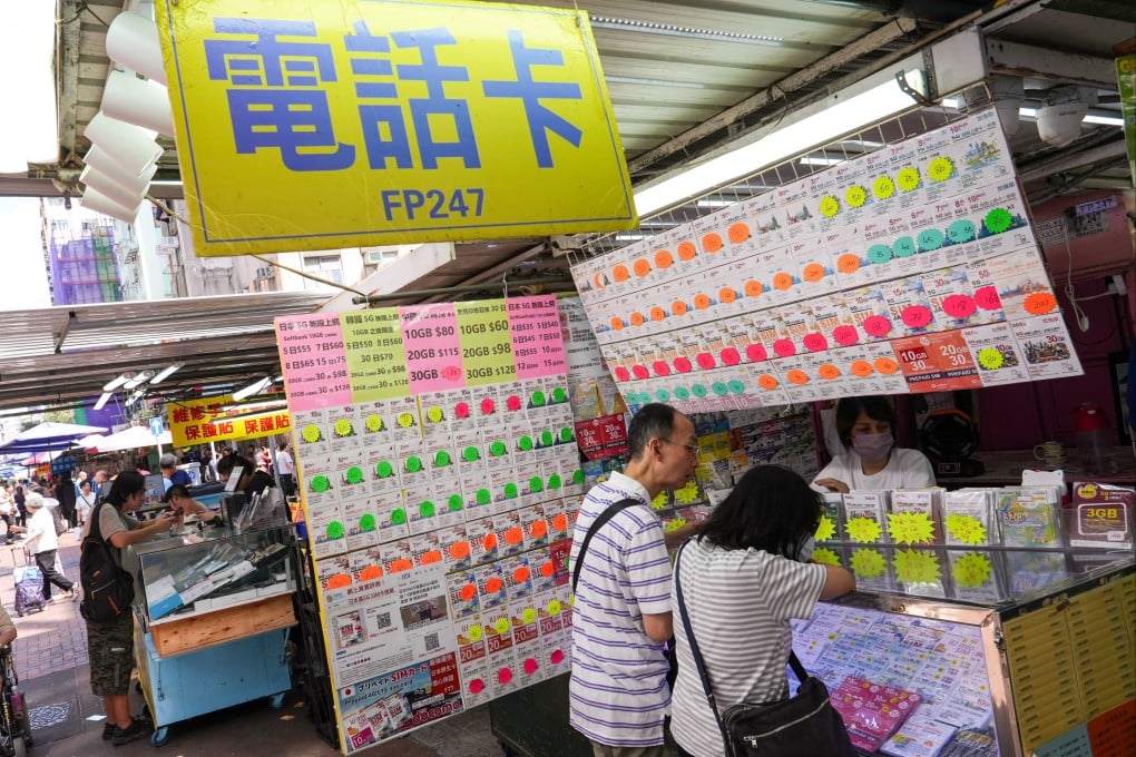 People buy SIM cards at Apliu Street in Sham Shum Po on July 14. Photo: Sun Yeung