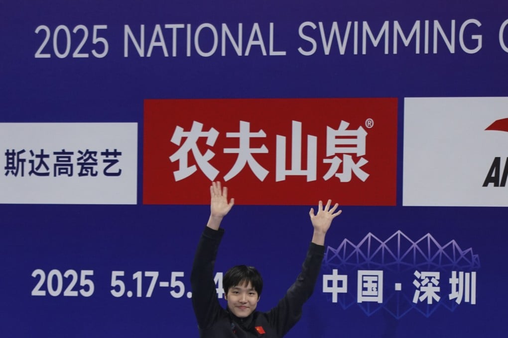 Twelve-year-old Chinese swimmer Yu Zidi celebrates on the podium after winning the 400m individual medley at the National Swimming Championships in Shenzhen in May. Photo: AP