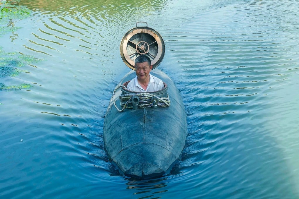 Chinese farmer Zhang Shengwu pilots his homemade submarine in a river in Hanshan county, in China’s eastern Anhui province. He built his own “Big Black Fish” -- a homemade submarine that stay underwater for 30 minutes at a time. Photo: AFP