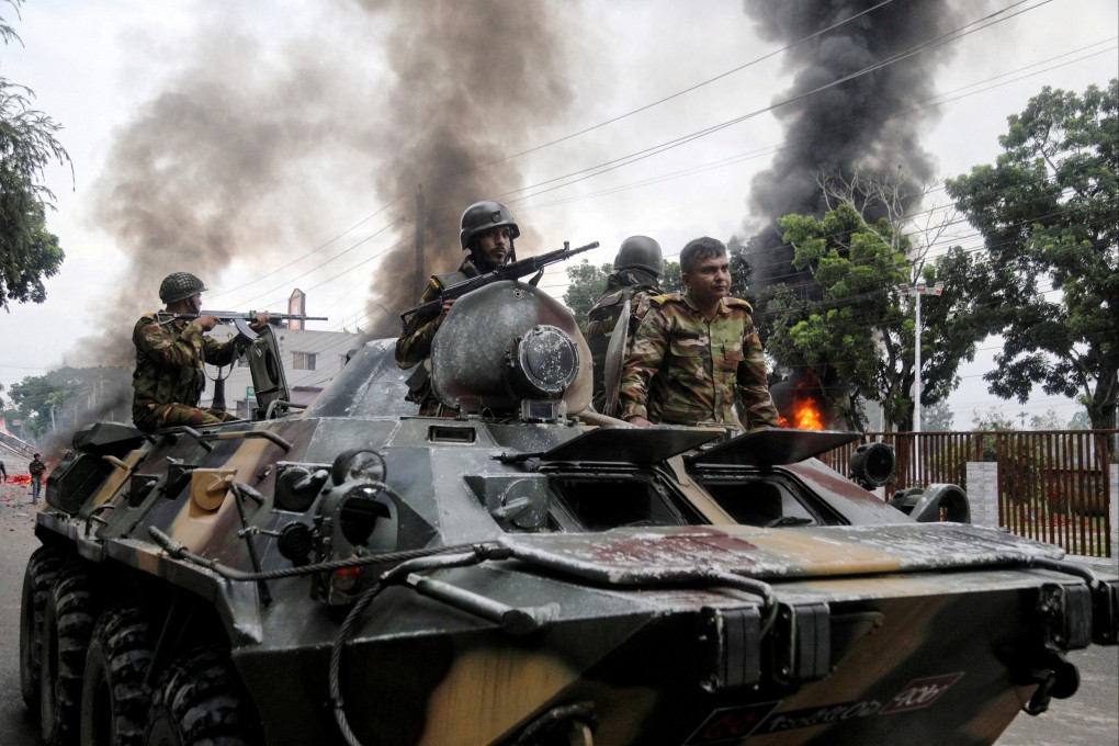Security forces patrol a street following a clash in Bangladesh’s Gopalganj district on July 16. Photo: Reuters