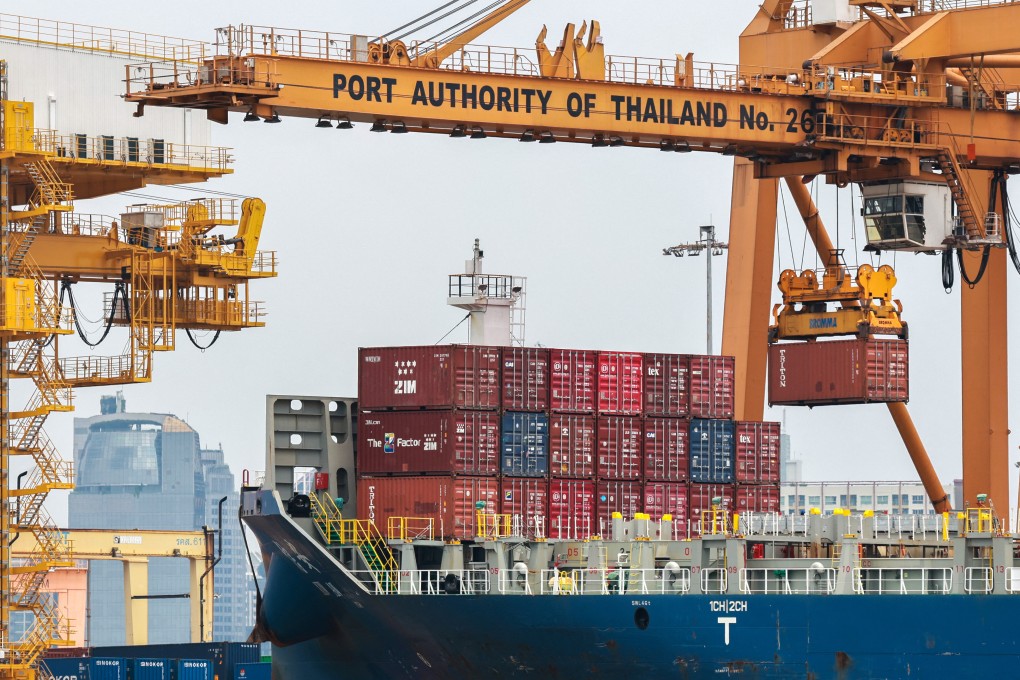 Cargo ships are loaded with containers as it is docked at the port of Bangkok. Photo: Reuters