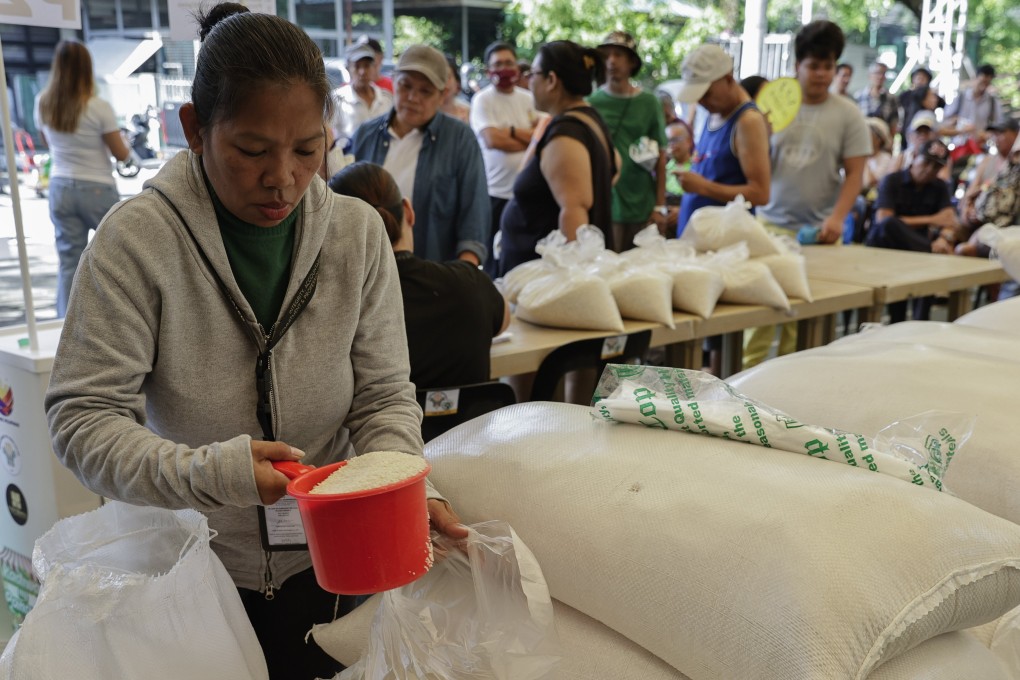 A worker prepares bags of rice to be sold at a government mini-market in Quezon City, Metro Manila, the Philippines, in May. Photo: EPA-EFE