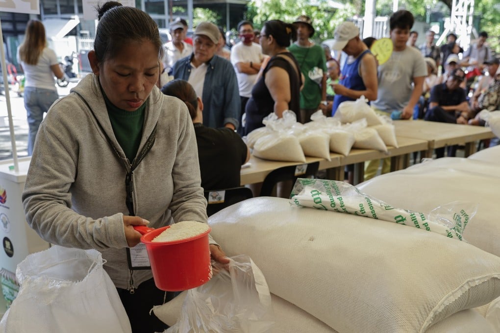 A worker prepares bags of rice to be sold at a government mini-market in Quezon City, Metro Manila, the Philippines, in May. Photo: EPA-EFE