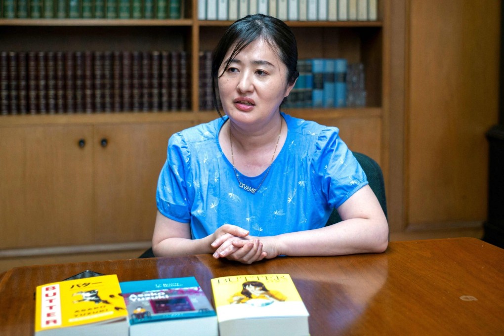 Japanese author Asako Yuzuki speaks during an interview in Tokyo on June 24, 2025. Her new novel Butter was inspired by the real-life story of “Black Widow” Kanae Kijima, a woman sentenced to death in 2012 for poisoning three men she met online. Photo: AFP