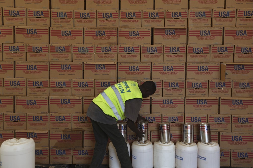 A man arranges USAID humanitarian aid inside a warehouse run by the World Food Programme (WFP) at Kakuma Refugee Camp in Turkana, Kenya. Photo: AP