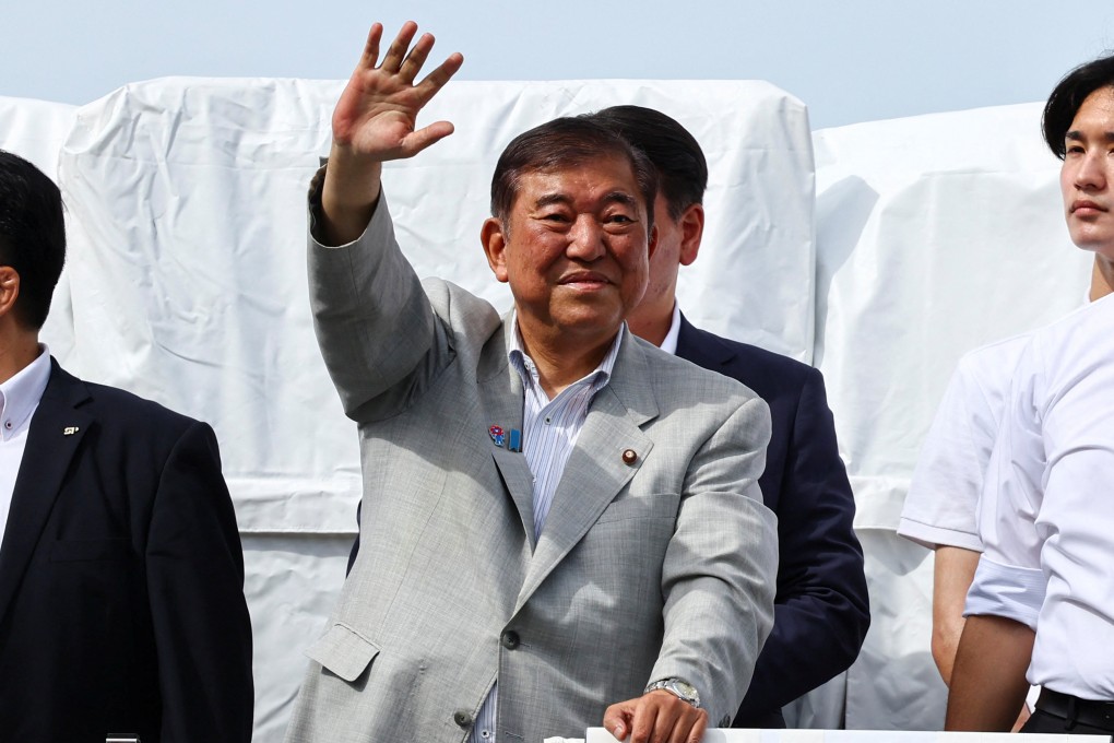 Japan’s Prime Minister Shigeru Ishiba, who is also the leader of the ruling Liberal Democratic Party, waves to voters from atop an election campaign van in Yokohama on Friday. Voters will head to the polls on Sunday for Japan’s upper house election. Photo: Reuters