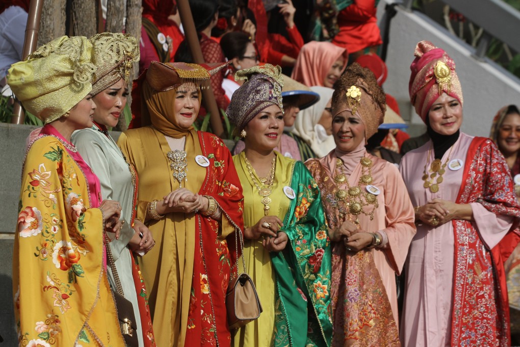 Indonesian women wear kebayas at a fashion show dedicated to the garment, which is a symbol of pride in many Southeast Asian countries. Photo: Anadolu Agency via Getty Images