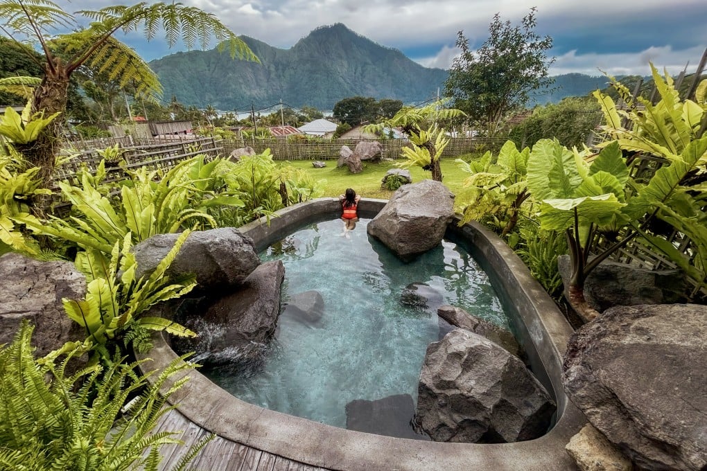 A private hot-spring jacuzzi at Onsen Bali, overlooking Lake Batur, Bali. Photo: Ian Neubauer