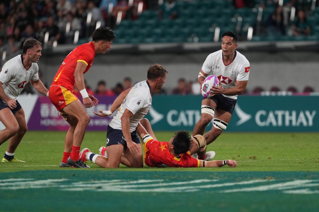 Hong Kong’s Michael Coverdale (right) holds the ball against China. Photo: Elson Li