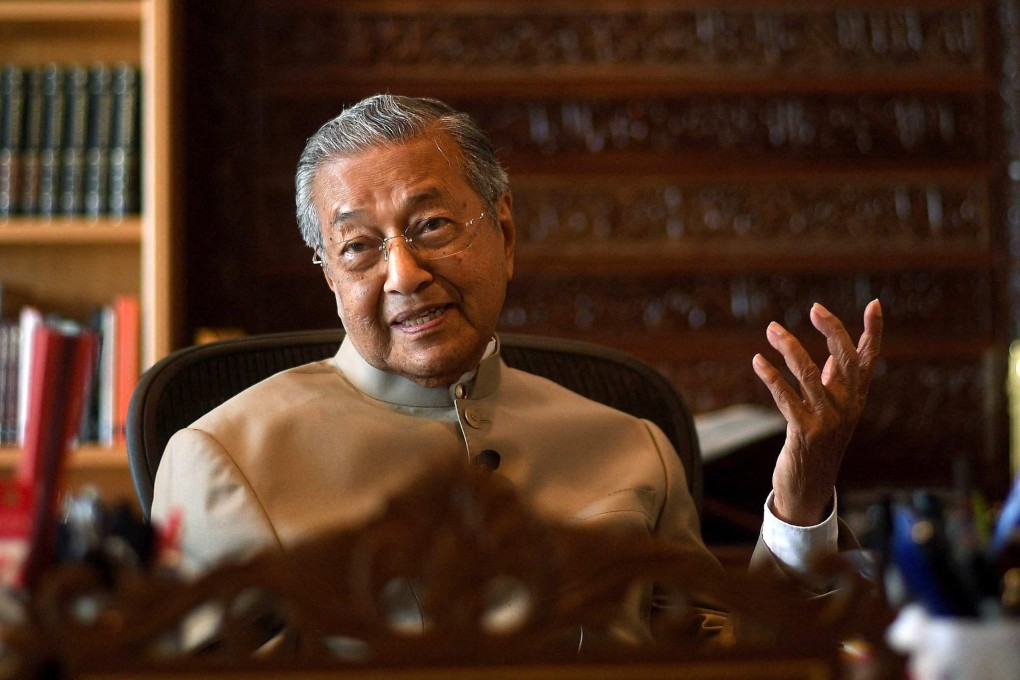 Malaysia’s former prime minister Mahathir Mohamad gestures during an interview at his office in Putrajaya. Photo: AFP