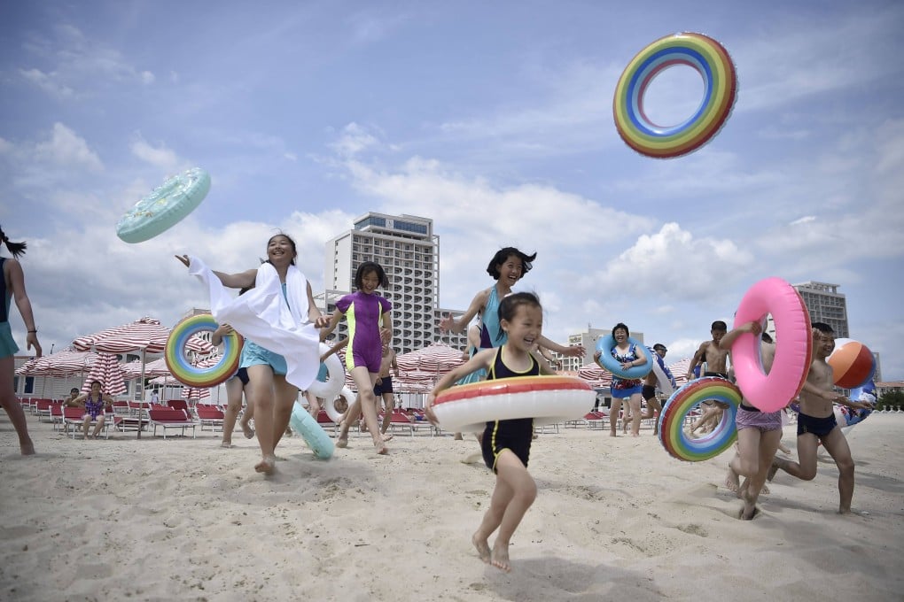 North Koreans visit the beach at the Wonsan-Kalma coastal tourist area in Kangwon province on July 1. Photo: AFP