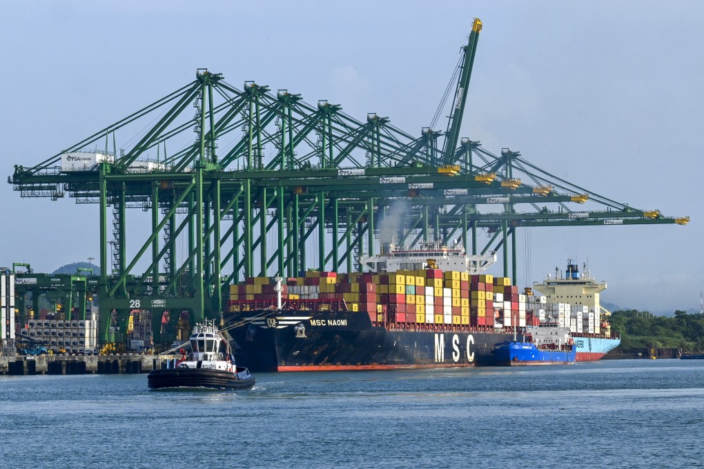 A ship is loaded with containers at the Panama Canal port of Balboa in June, 2023. Photo: AFP