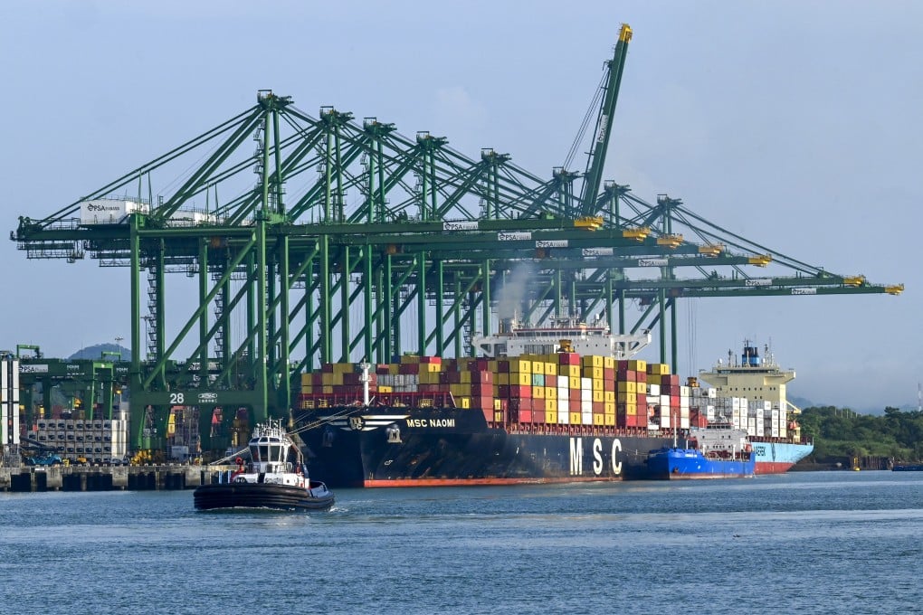A ship is loaded with containers at the Panama Canal port of Balboa in June, 2023. Photo: AFP
