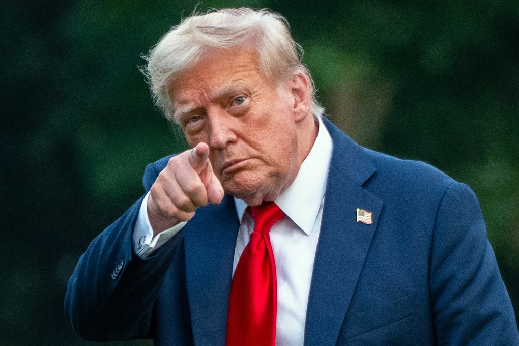 US President Donald Trump points toward reporters as he arrives at the White House on Sunday. Photo: dpa