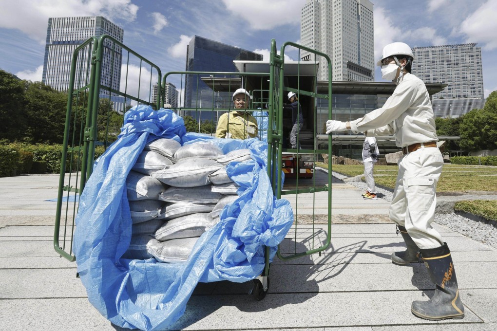 Bags of decontaminated but slightly radioactive soil, are delivered to the Japanese prime minister’s office in Tokyo on Saturday. Photo: AP