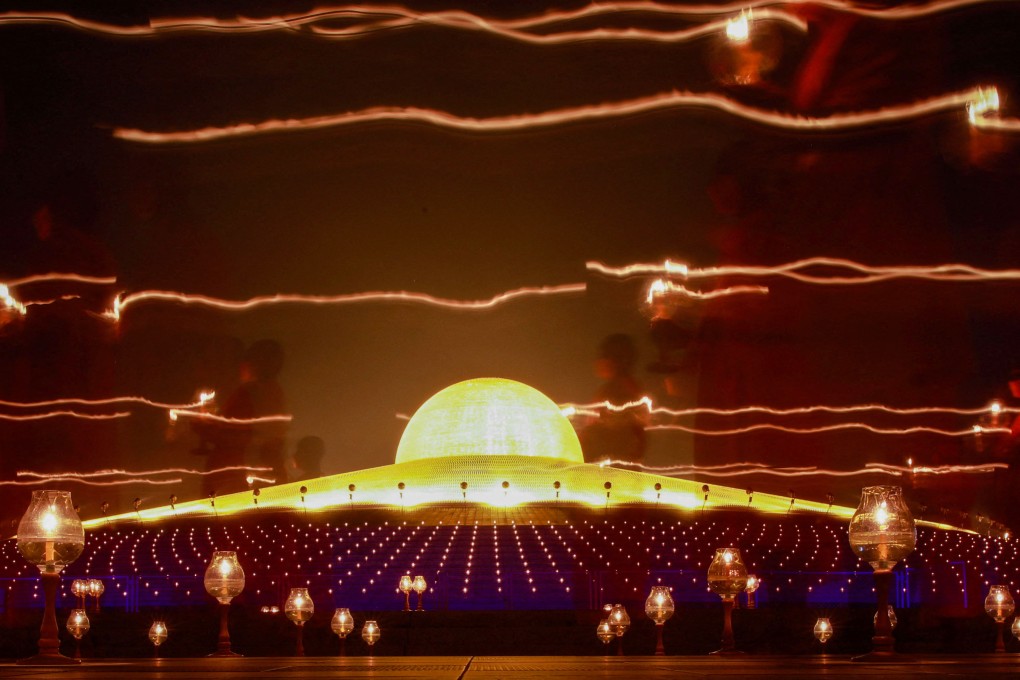 Buddhist monks take part in a ceremony at a temple in Thailand’s Pathum Thani province. Monks traditionally survive on alms and food offerings. Photo: Reuters