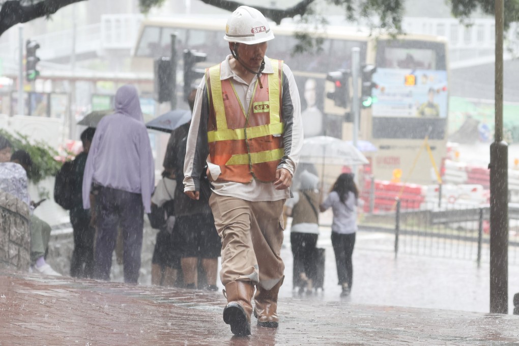 Residents walk through heavy rain in the Diamond Hill area on Friday. Photo: Edmond So