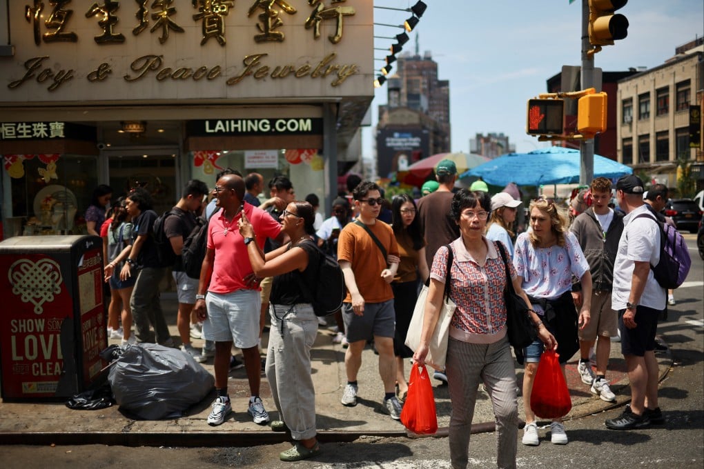 Pedestrians walk in New York City’s Chinatown on July 5. Photo: Reuters